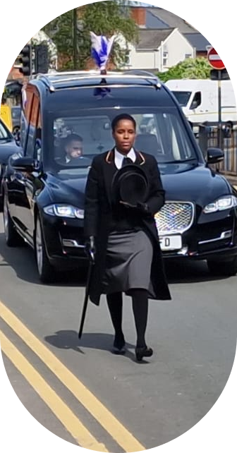 Funeral director holding umbrella